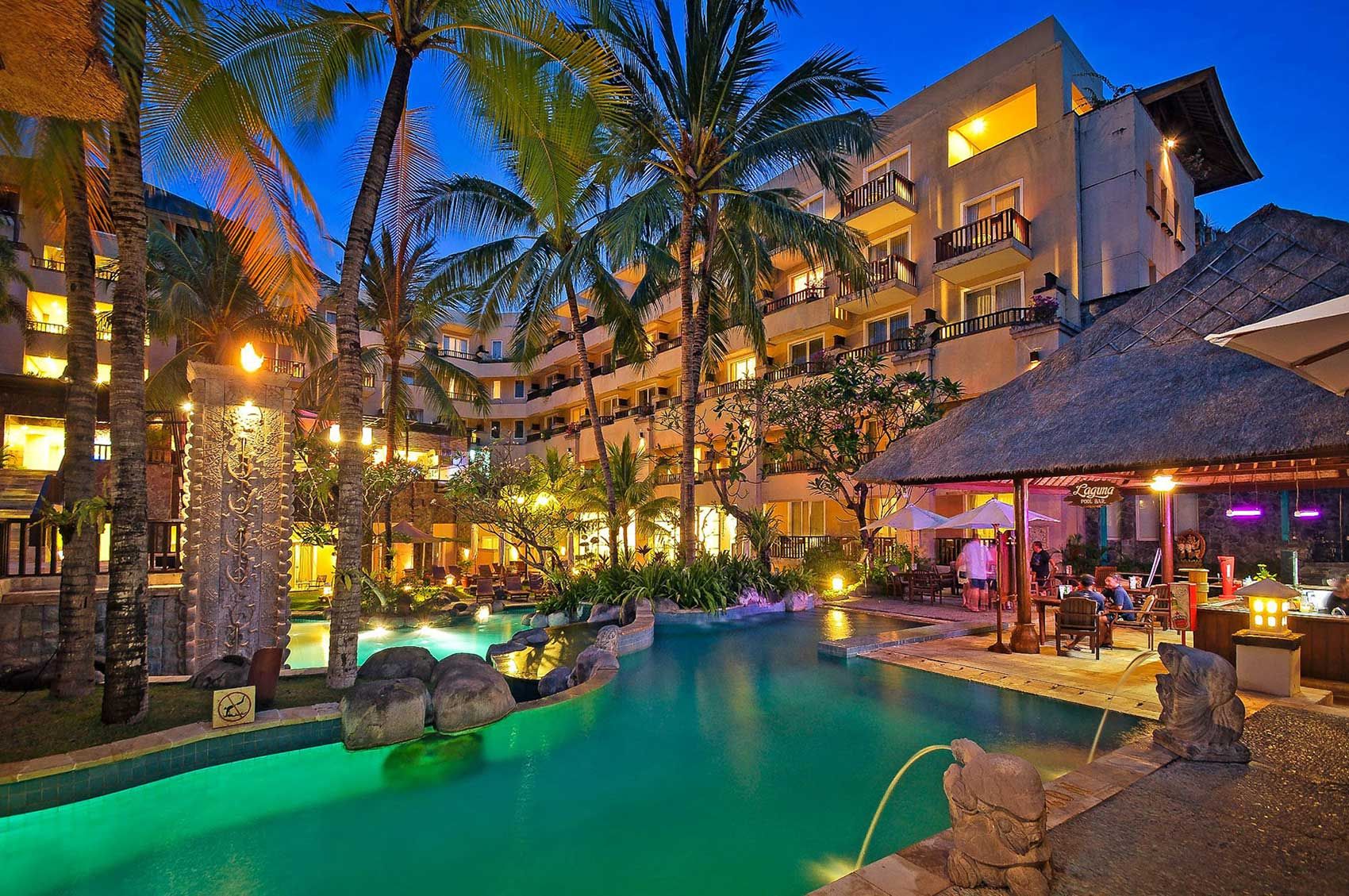 Kuta Paradiso — illuminated pool courtyard at twilight