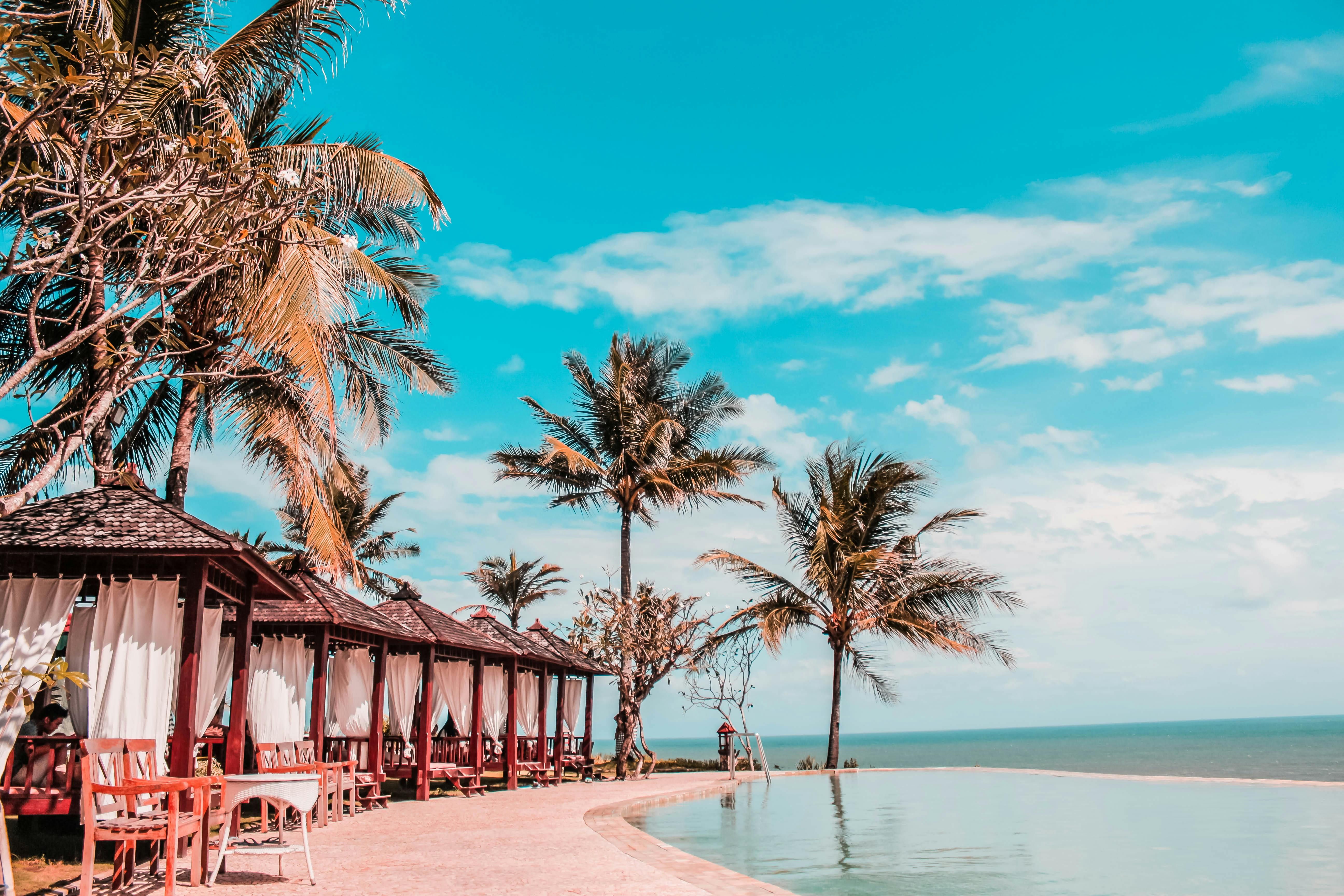 beachfront resort infinity pool Jimbaran sunset