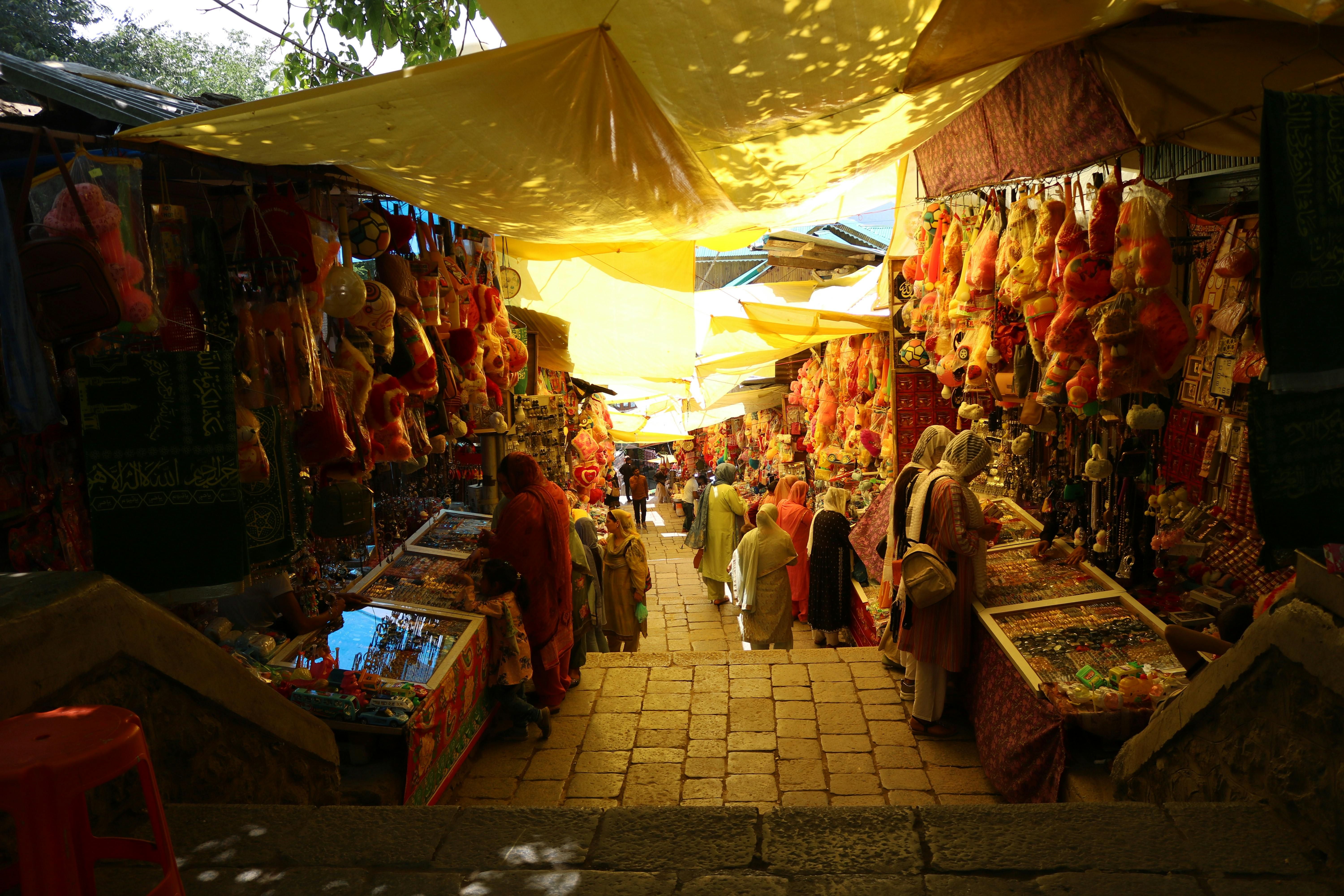 Bali — Colorful market scene in Aishmuqam, showcasing bustling stalls and vibrant local atmosphere.