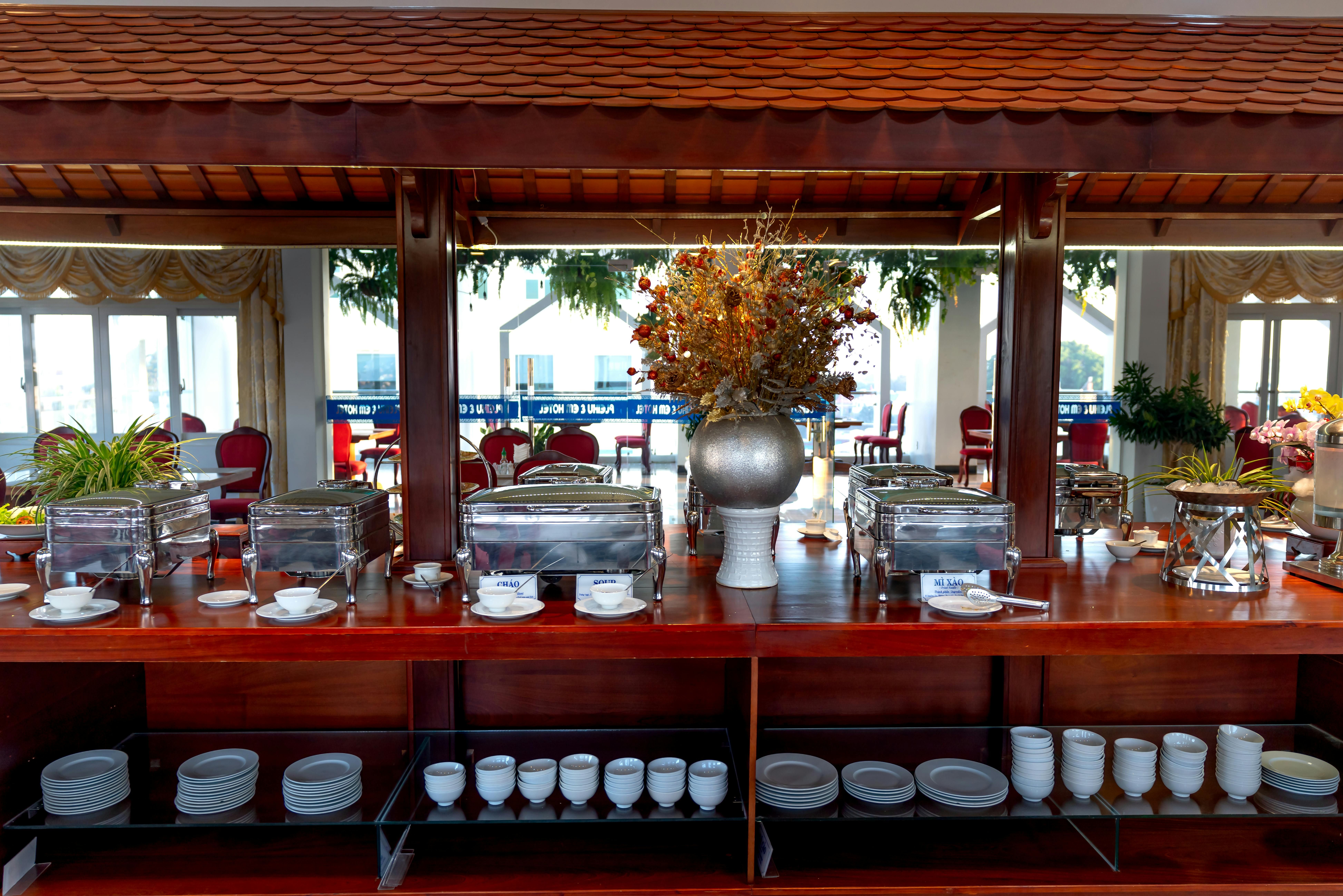 Bali — Elegant buffet counter with stainless setup in a bright, stylish restaurant interior.