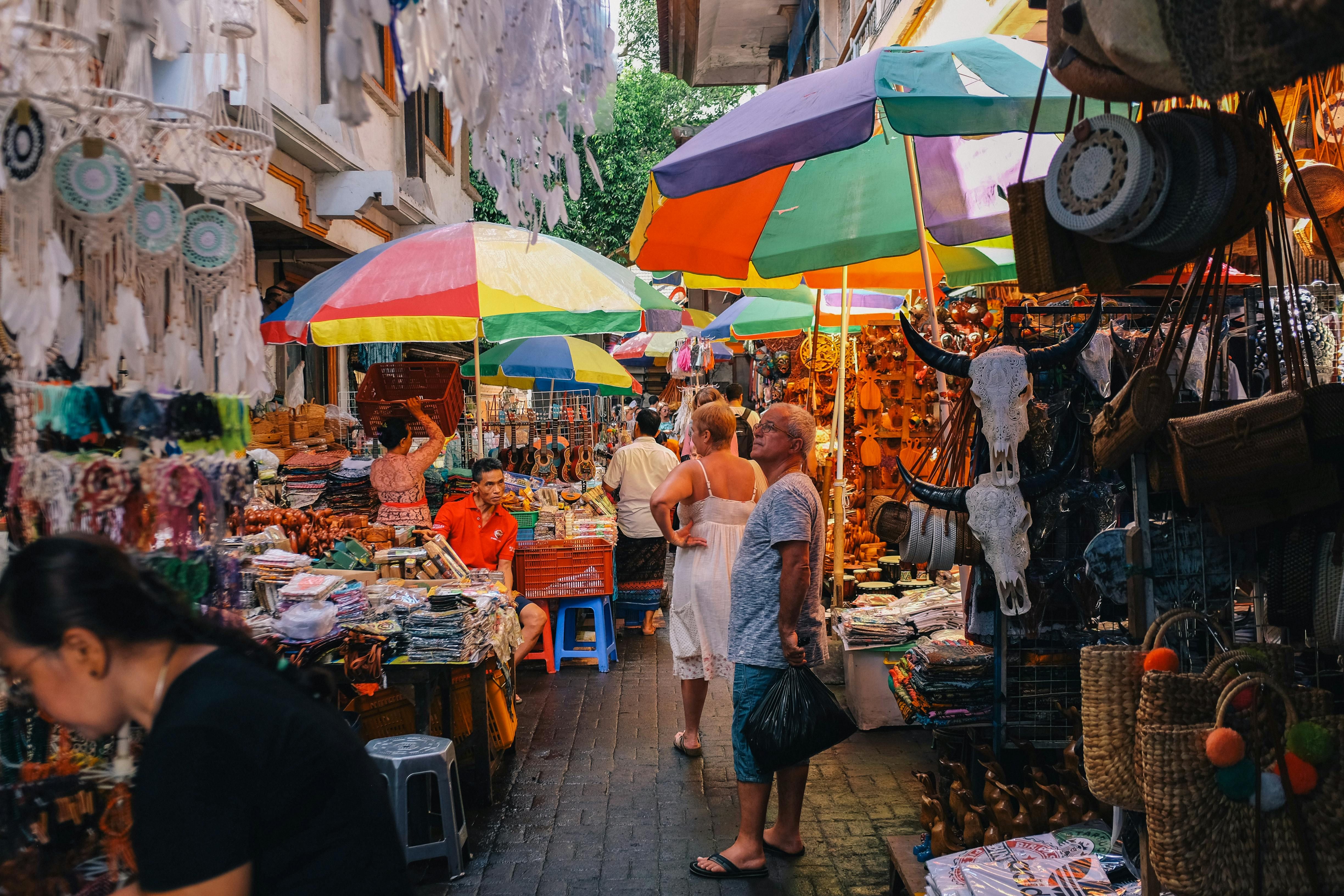 Bali — Bustling outdoor market with vibrant stalls and diverse shoppers.