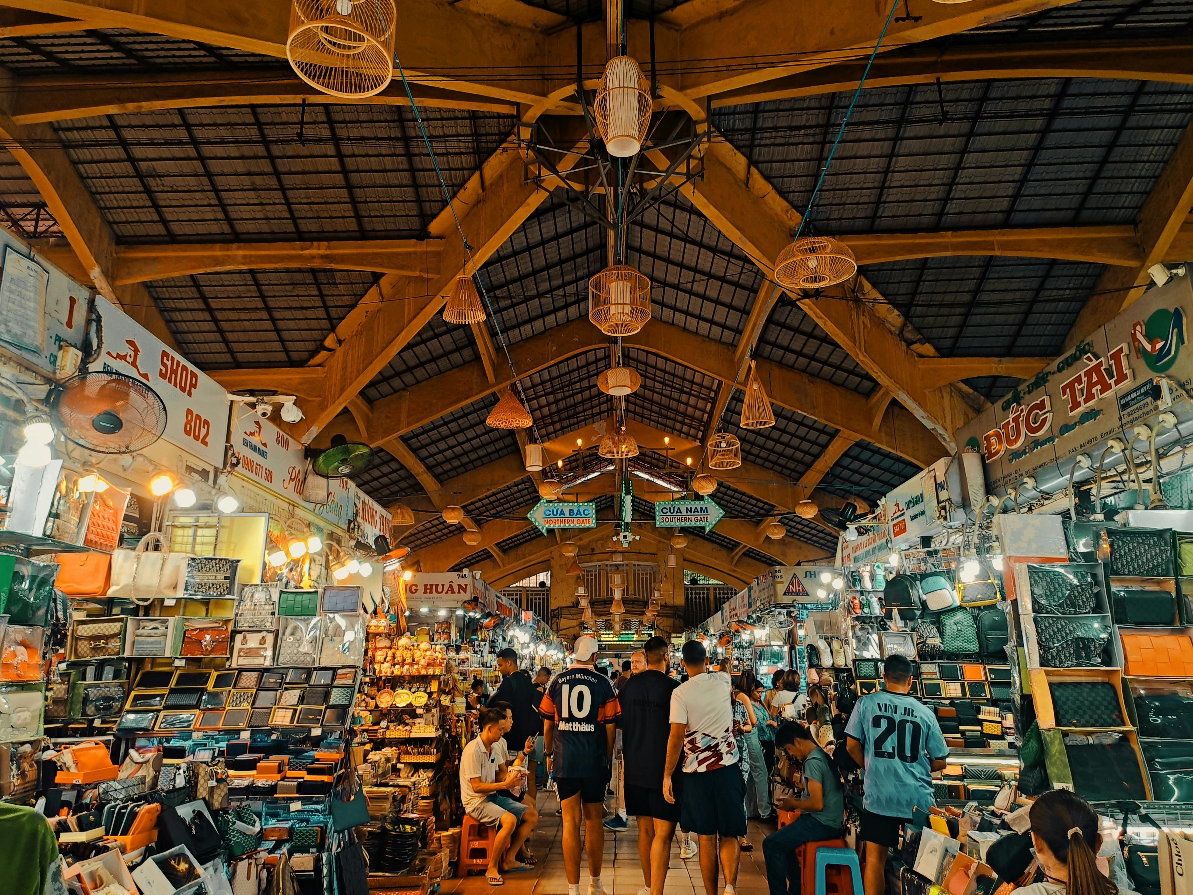 Bali — Busy indoor market with people shopping under wooden beams.