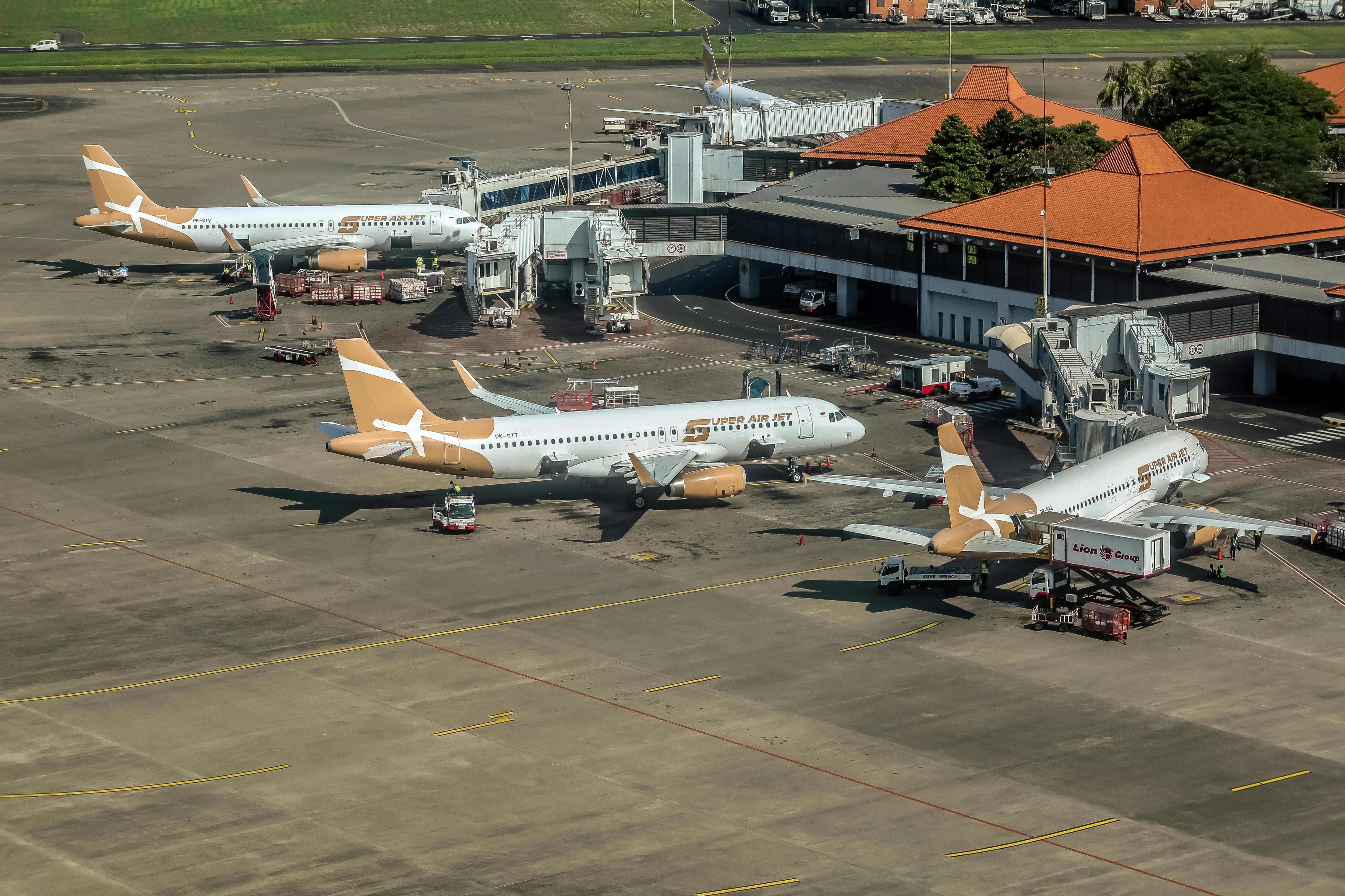 Bali — Aerial view of airplanes at a Balinese airport terminal during daytime.