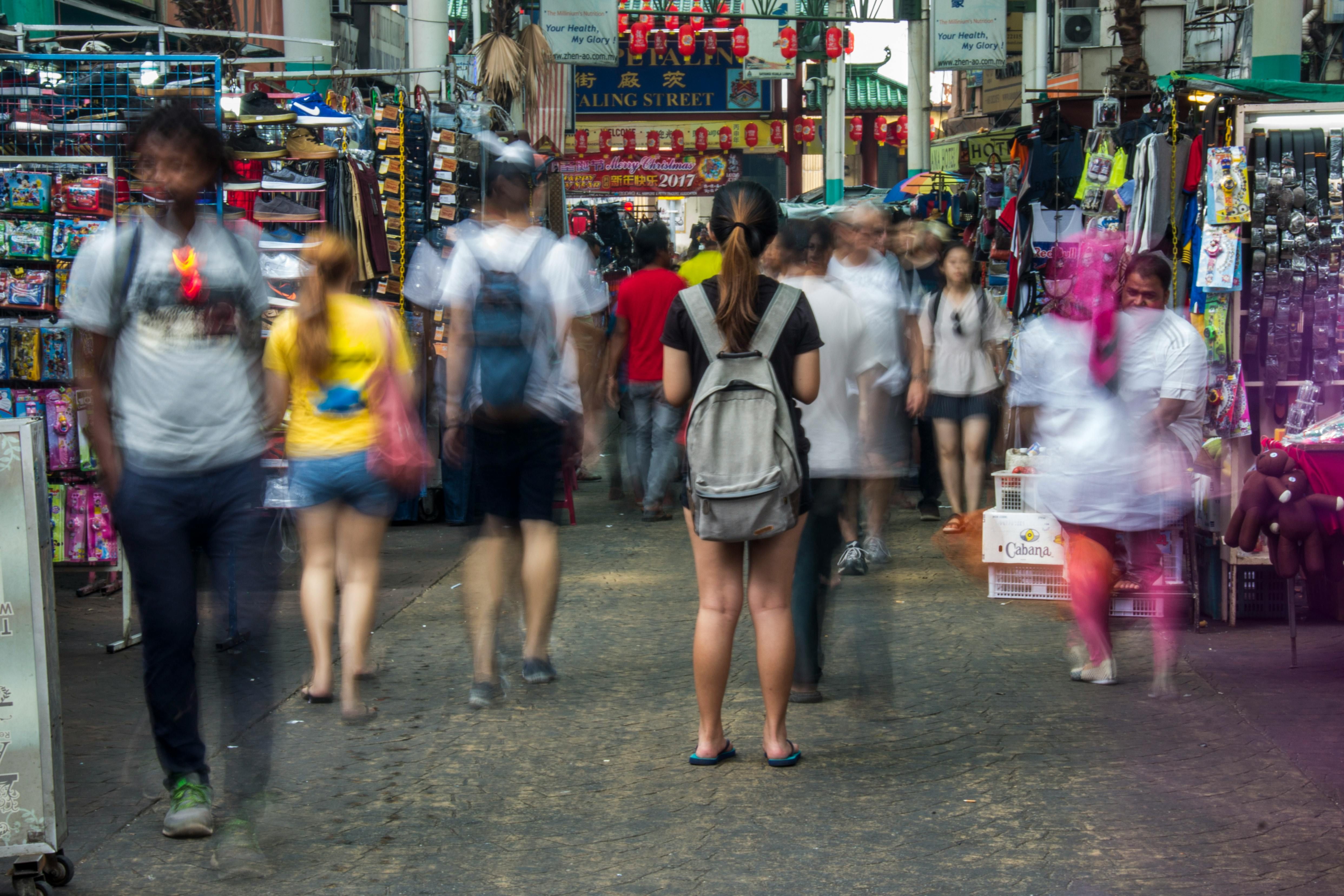 Bali — Busy street market in Kuala Lumpur with blurred motion of people shopping and exploring.