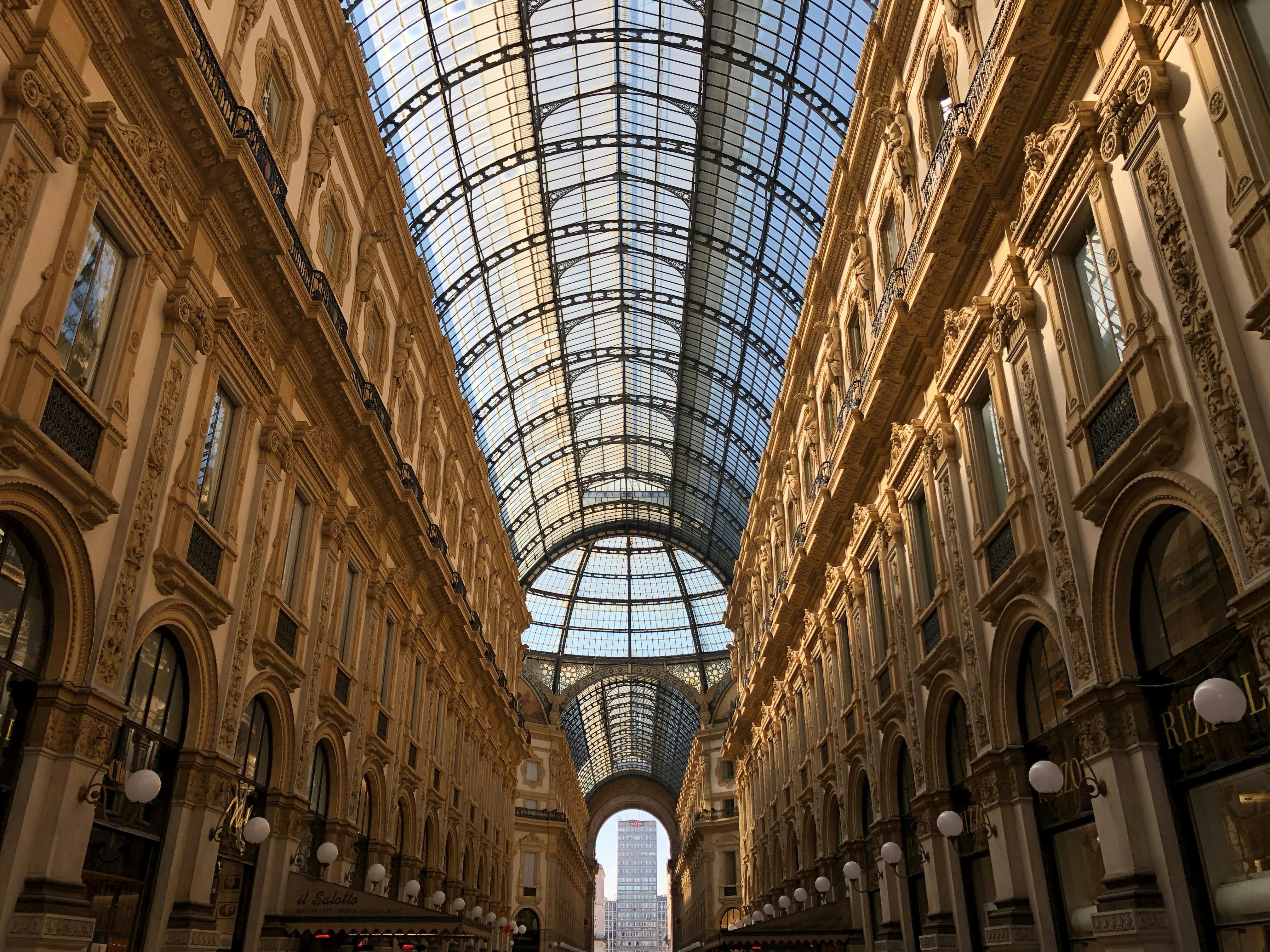Italy — Stunning architectural shot of Galleria Vittorio Emanuele II in Milan showcasing its arched glass ceiling.