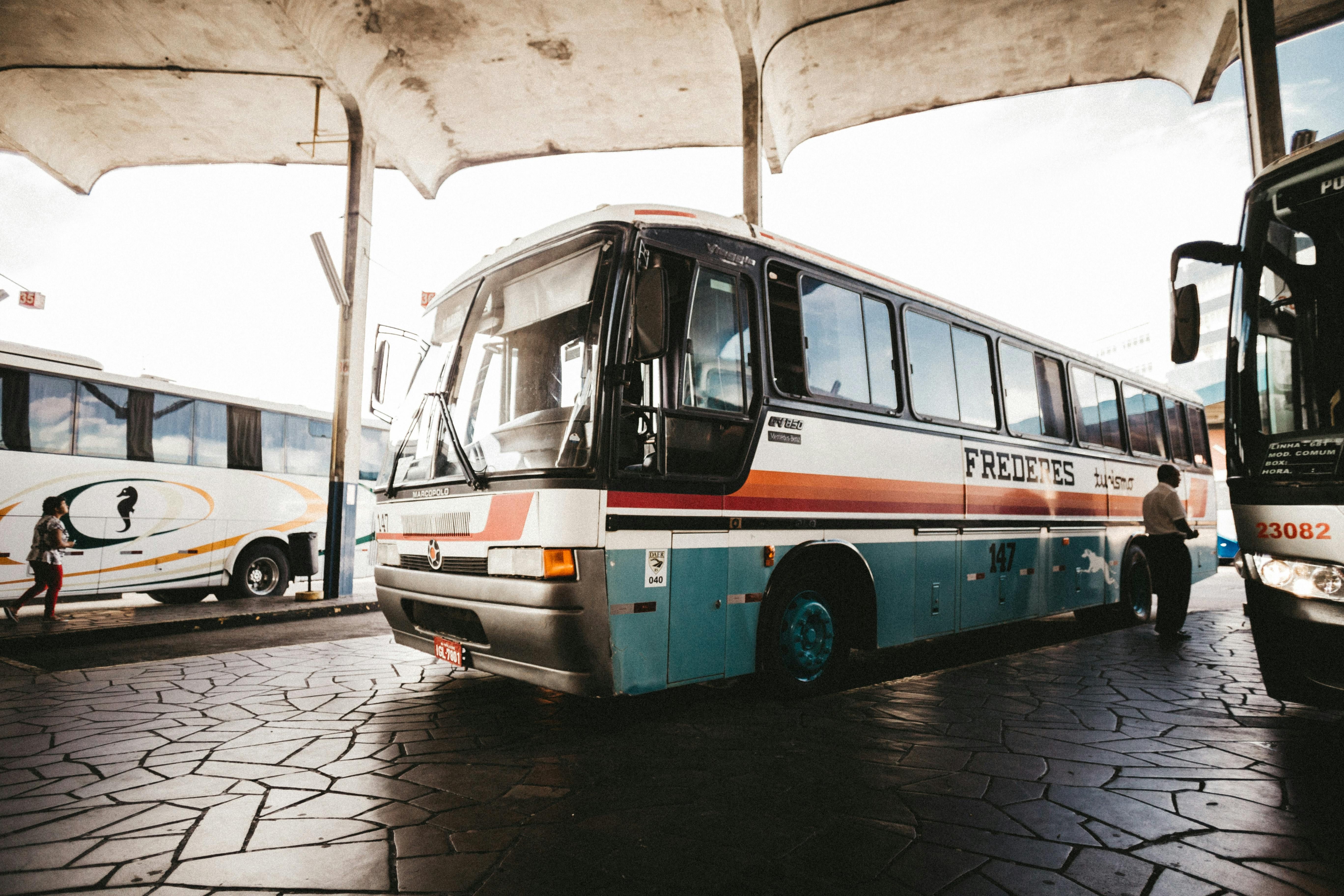 Italy — Colorful bus at an outdoor station captures transportation dynamics.