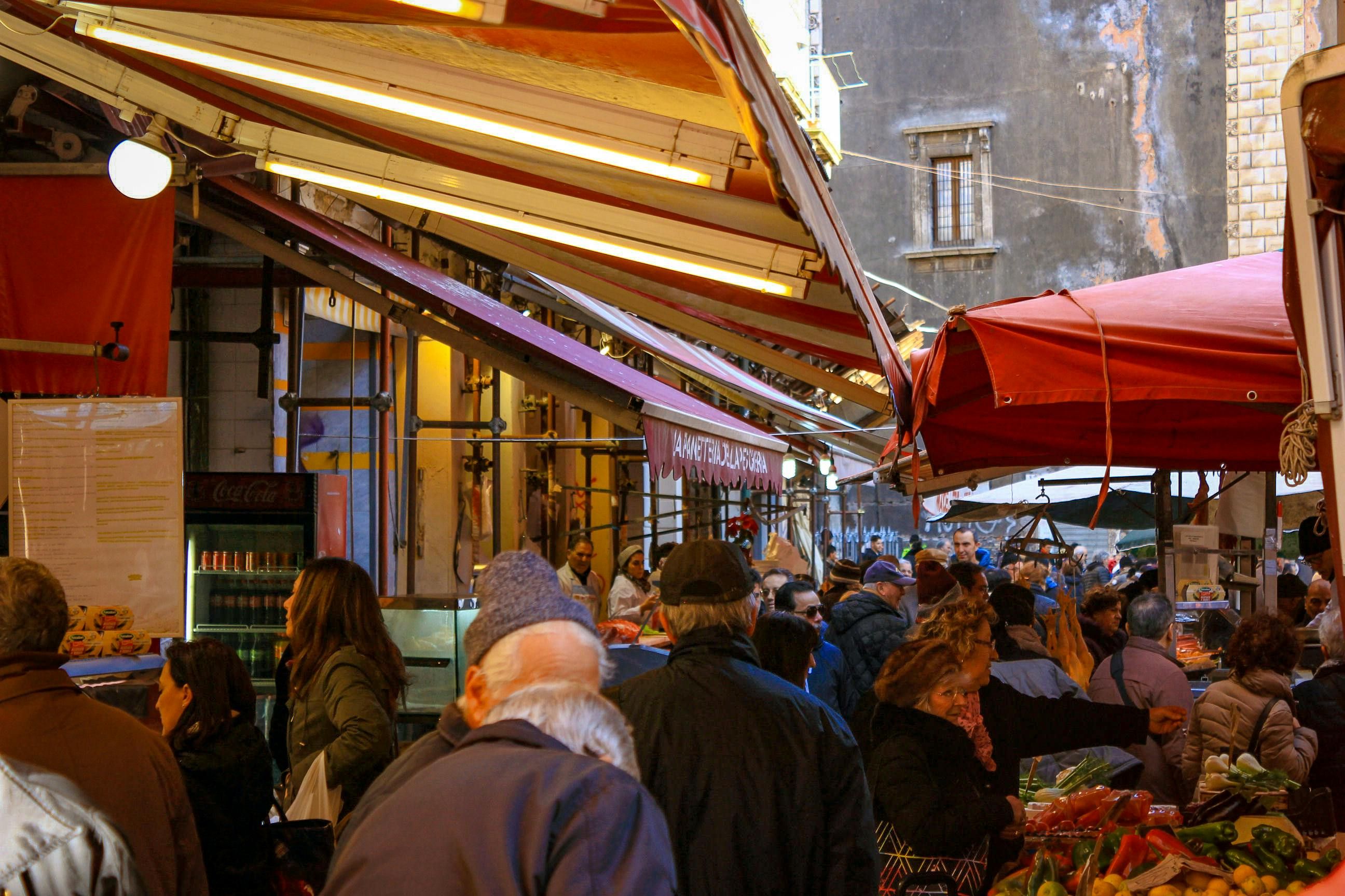 Italy — Experience the bustling street market in Catania, Sicily, full of local flavor and culture.