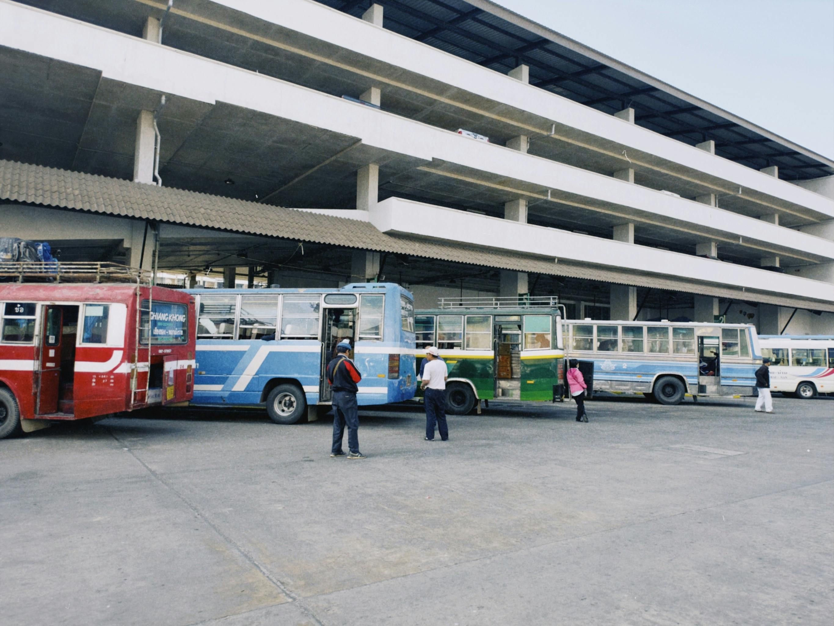 Mexico — An urban bus station with several colorful buses parked, capturing public transportation in action.