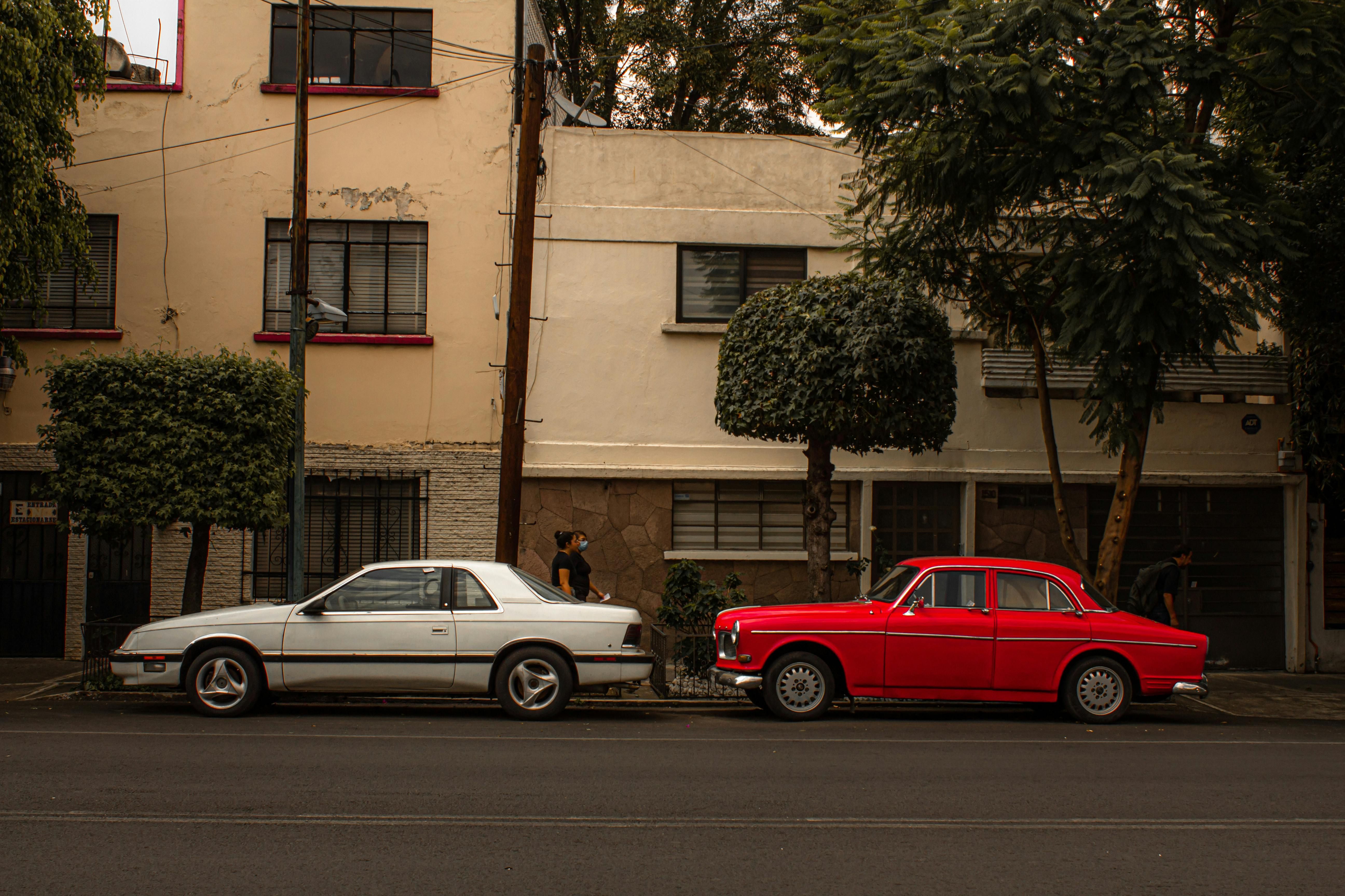 Mexico — Vintage cars alongside a city street in Mexico City, offering a retro and nostalgic vibe.