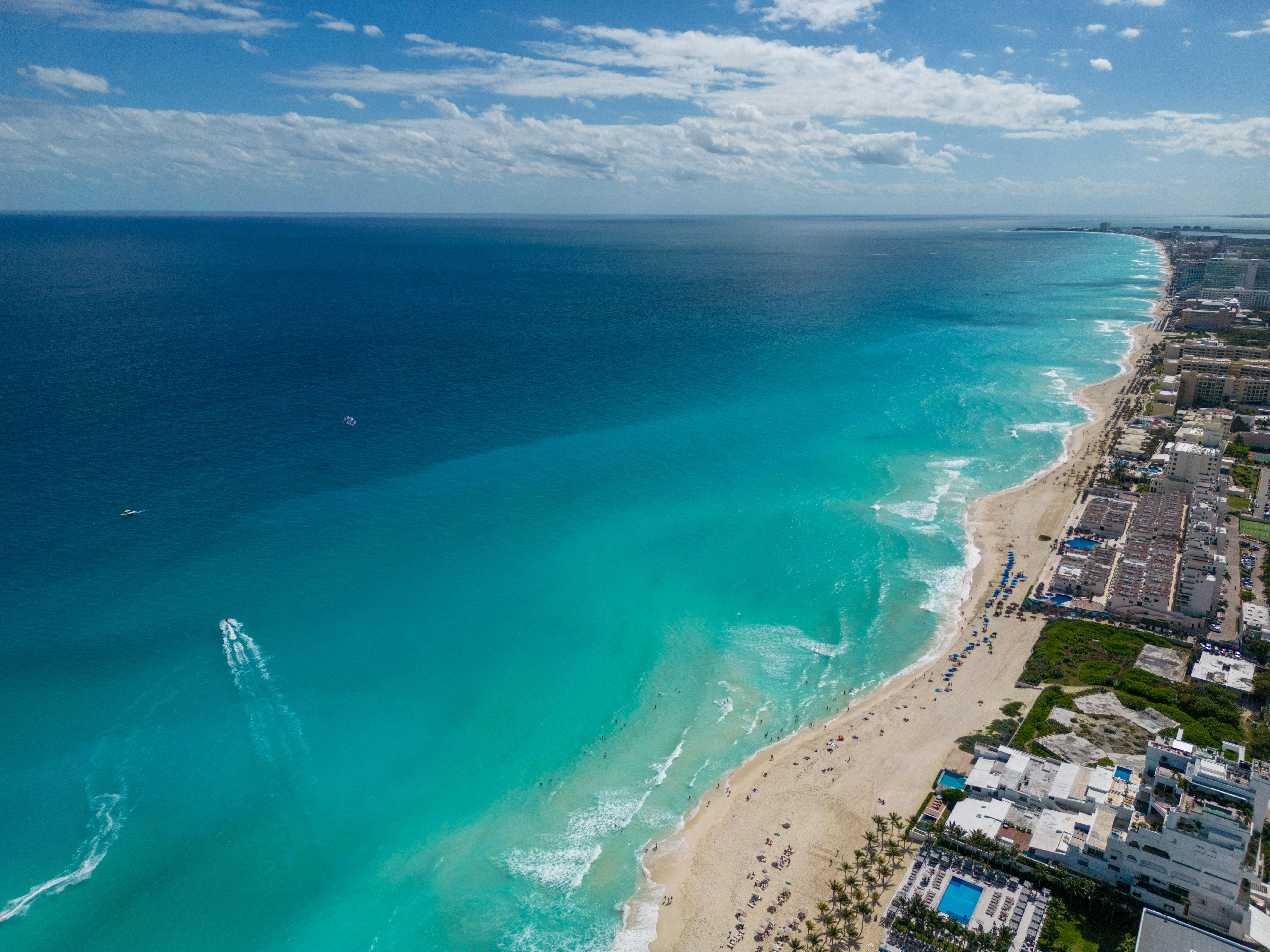 Mexico — A breathtaking aerial view of Cancun's turquoise waters and sandy beaches lined with hotels.