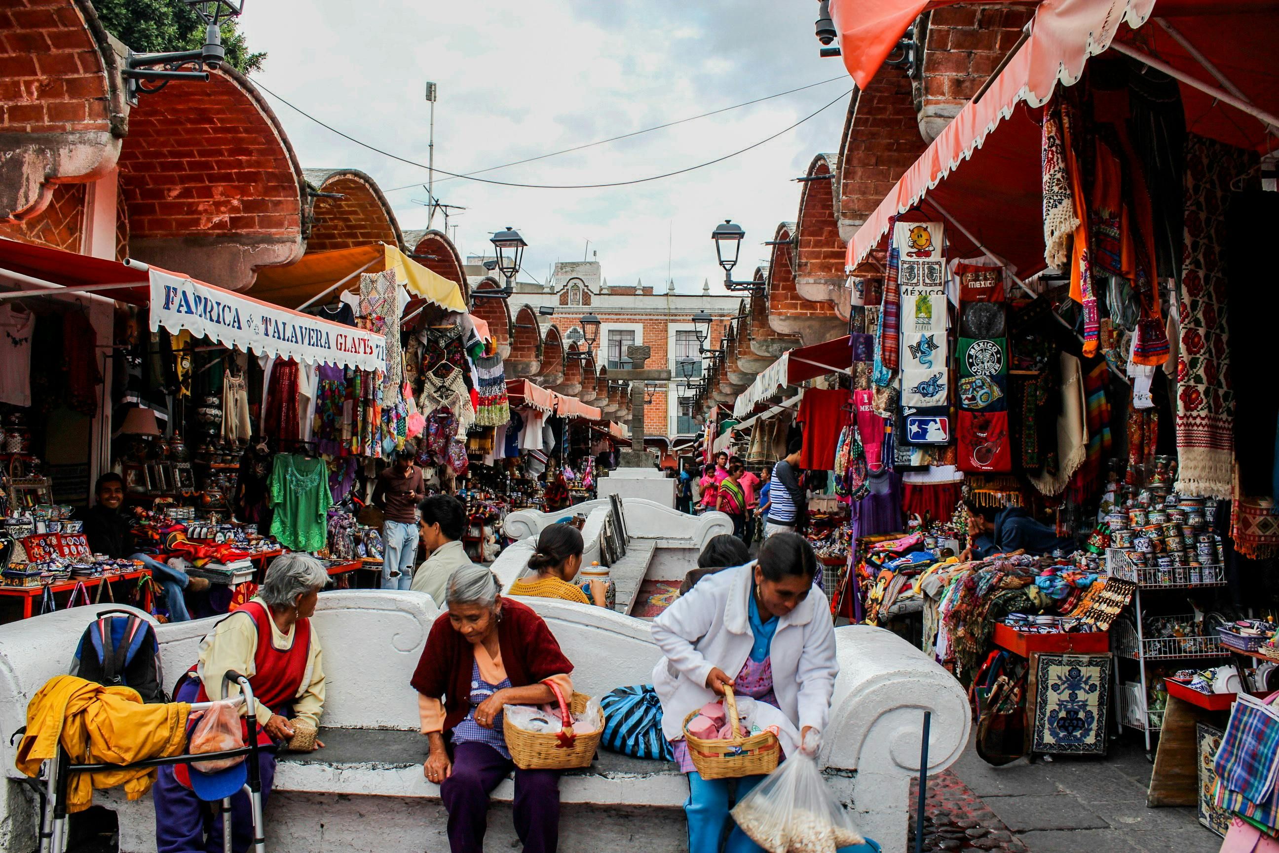 Mexico — Vibrant street market in Puebla, Mexico featuring local vendors selling handcrafted goods.