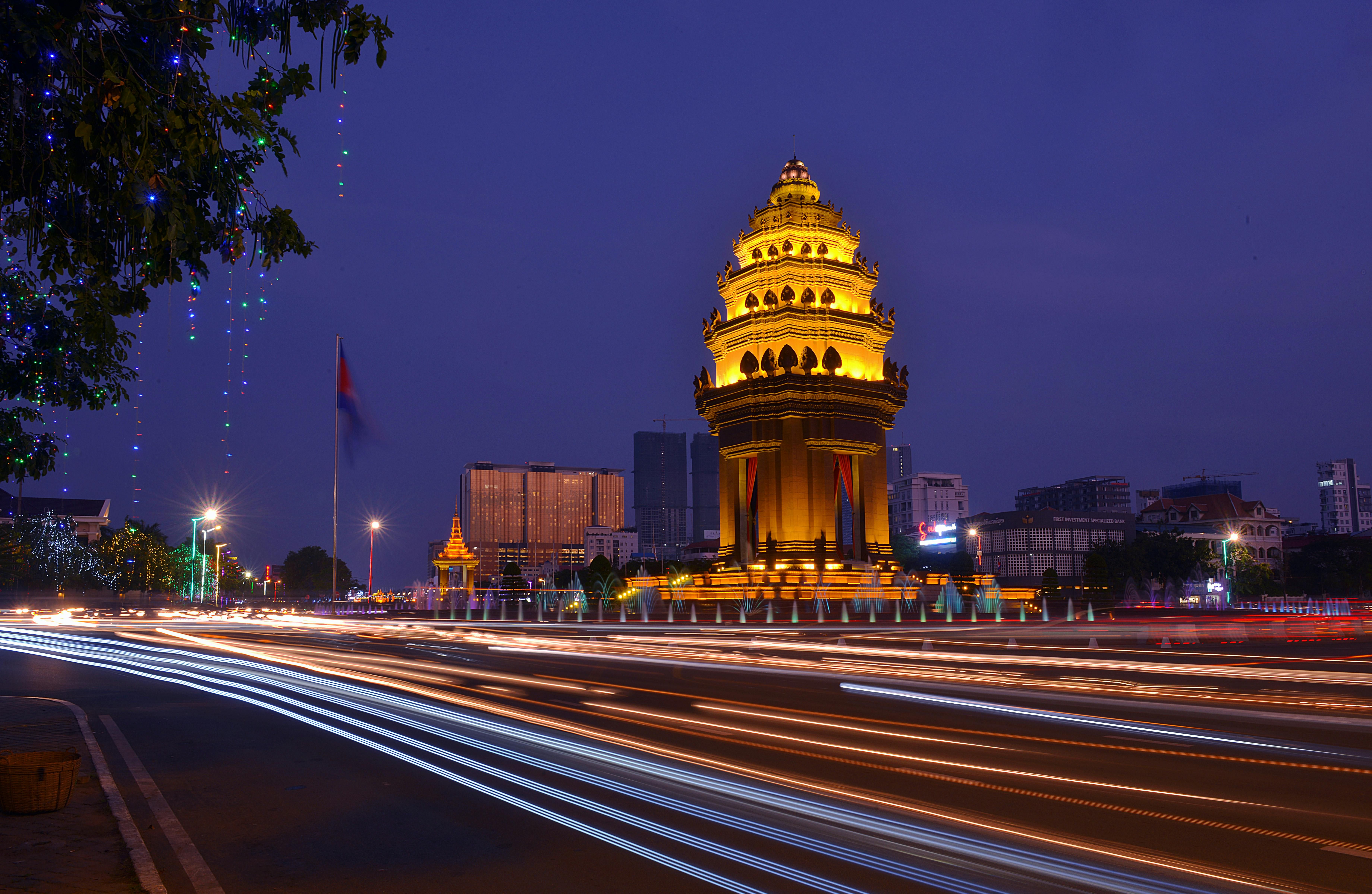 Phnom Penh Landscape β Long exposure night photograph of the illuminated Independence Monument with light streaks in Phnom Penh, Cambodia.