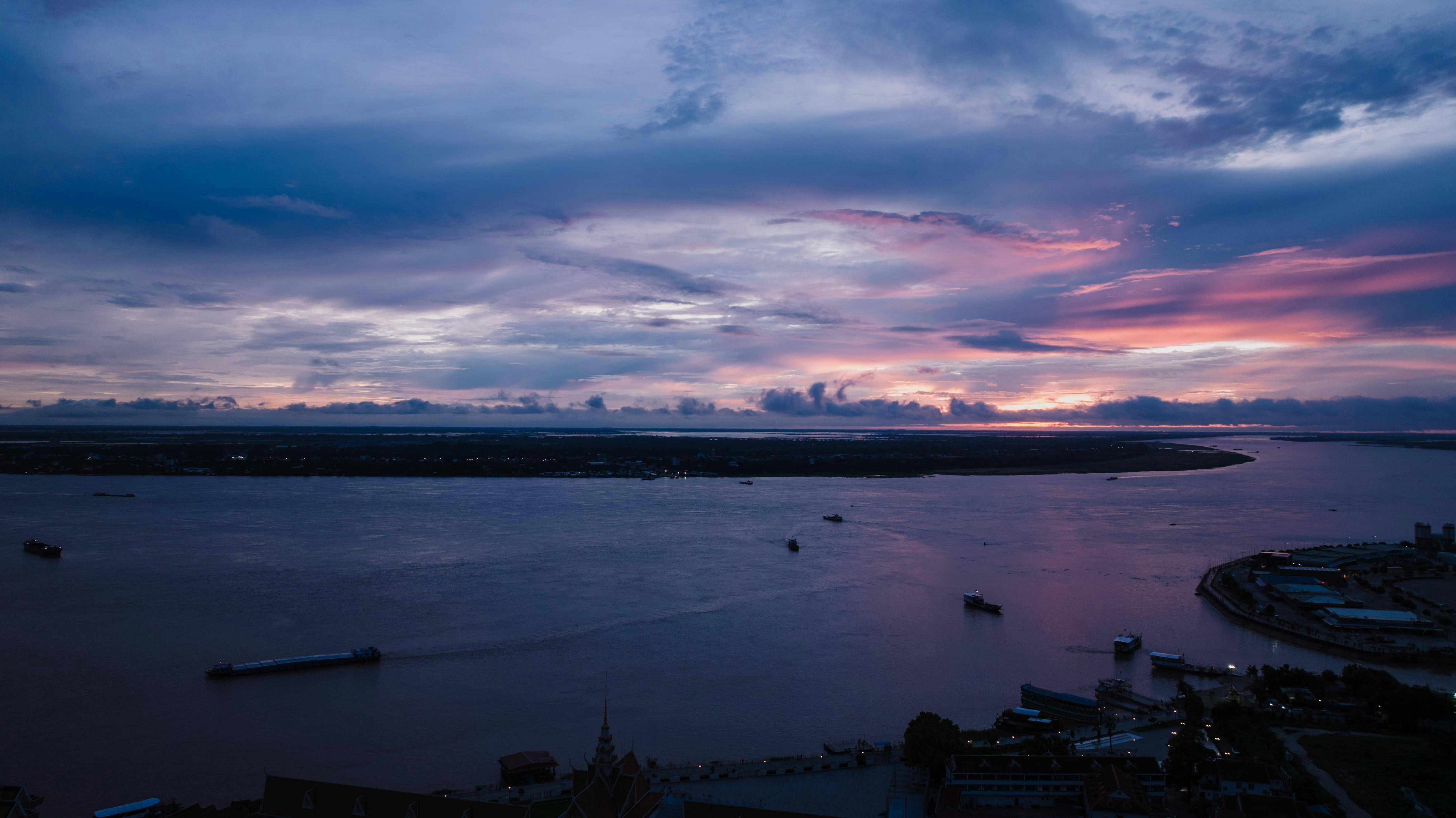 Phnom Penh — A breathtaking aerial view of sunset over the river in Phnom Penh, Cambodia.