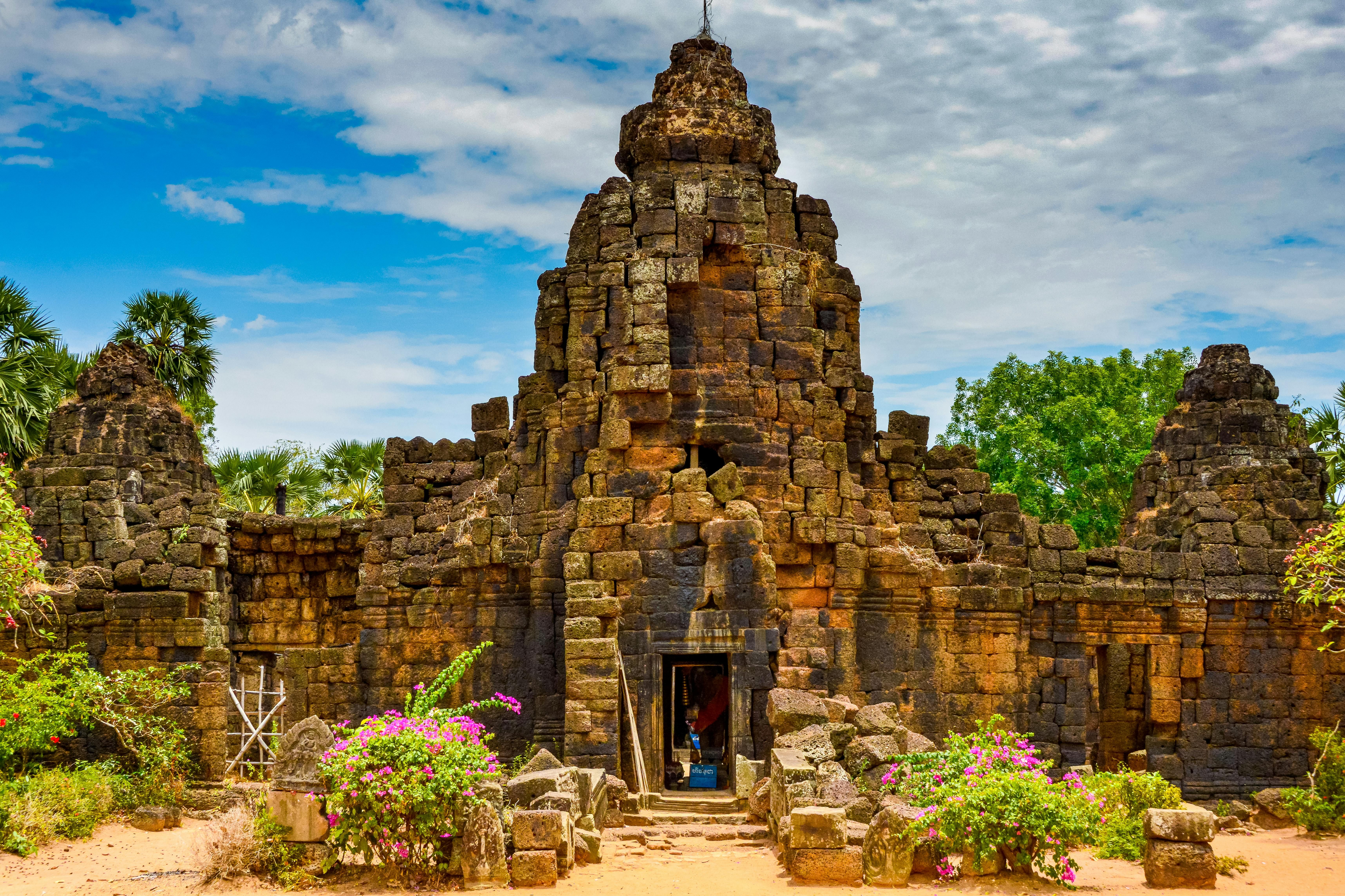 Phu Quoc Historic β Explore the captivating ancient Khmer temple ruins with vibrant flora in Cambodia.