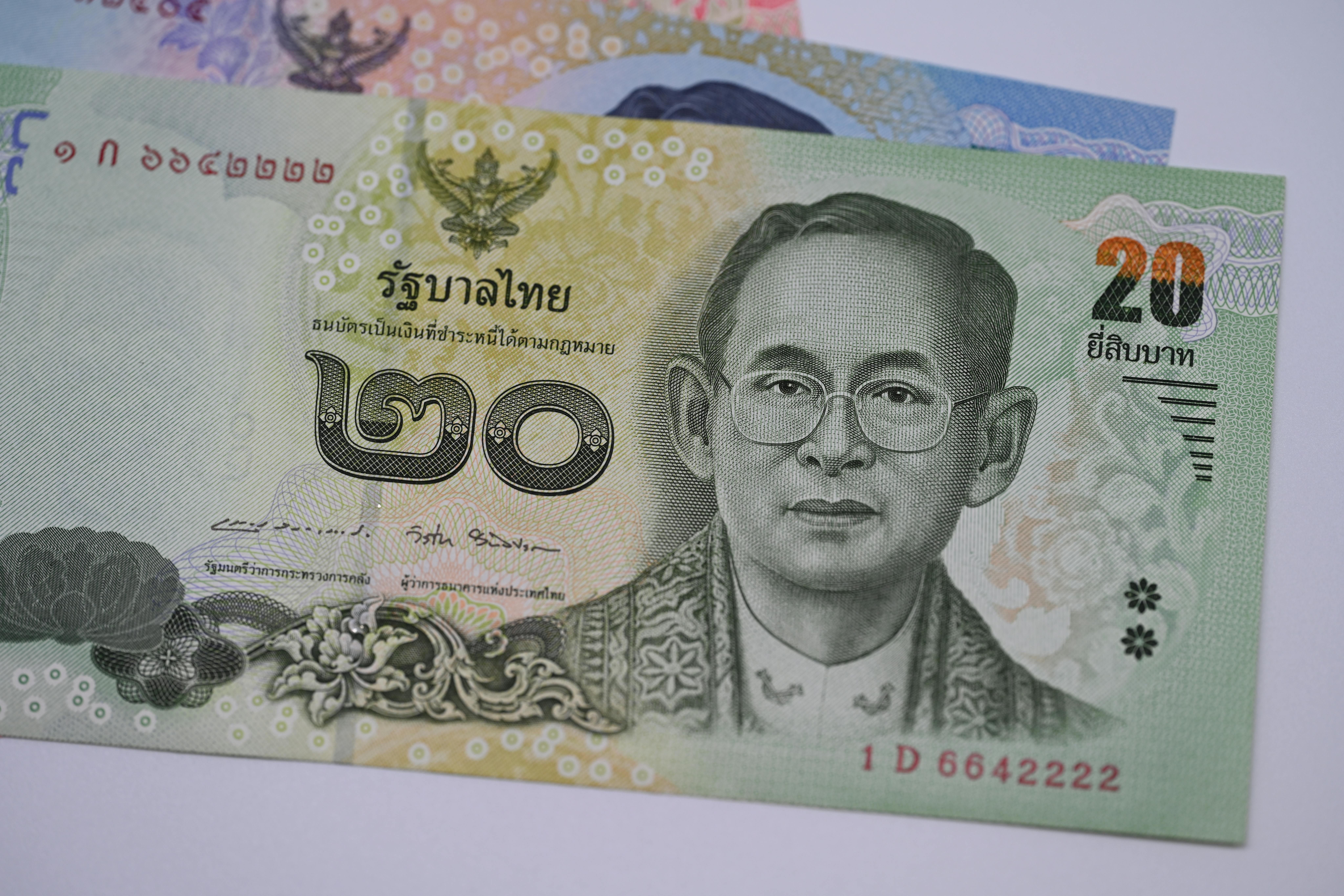 Thailand — Detailed image of a 20 Thai Baht banknote highlighting traditional Thai design and currency features.